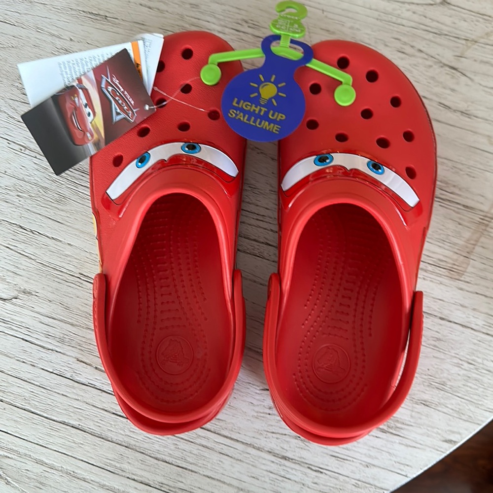 Men’s size 8, women’s 10 Crocs. Disney cars. Light up. Never worn. Tags.